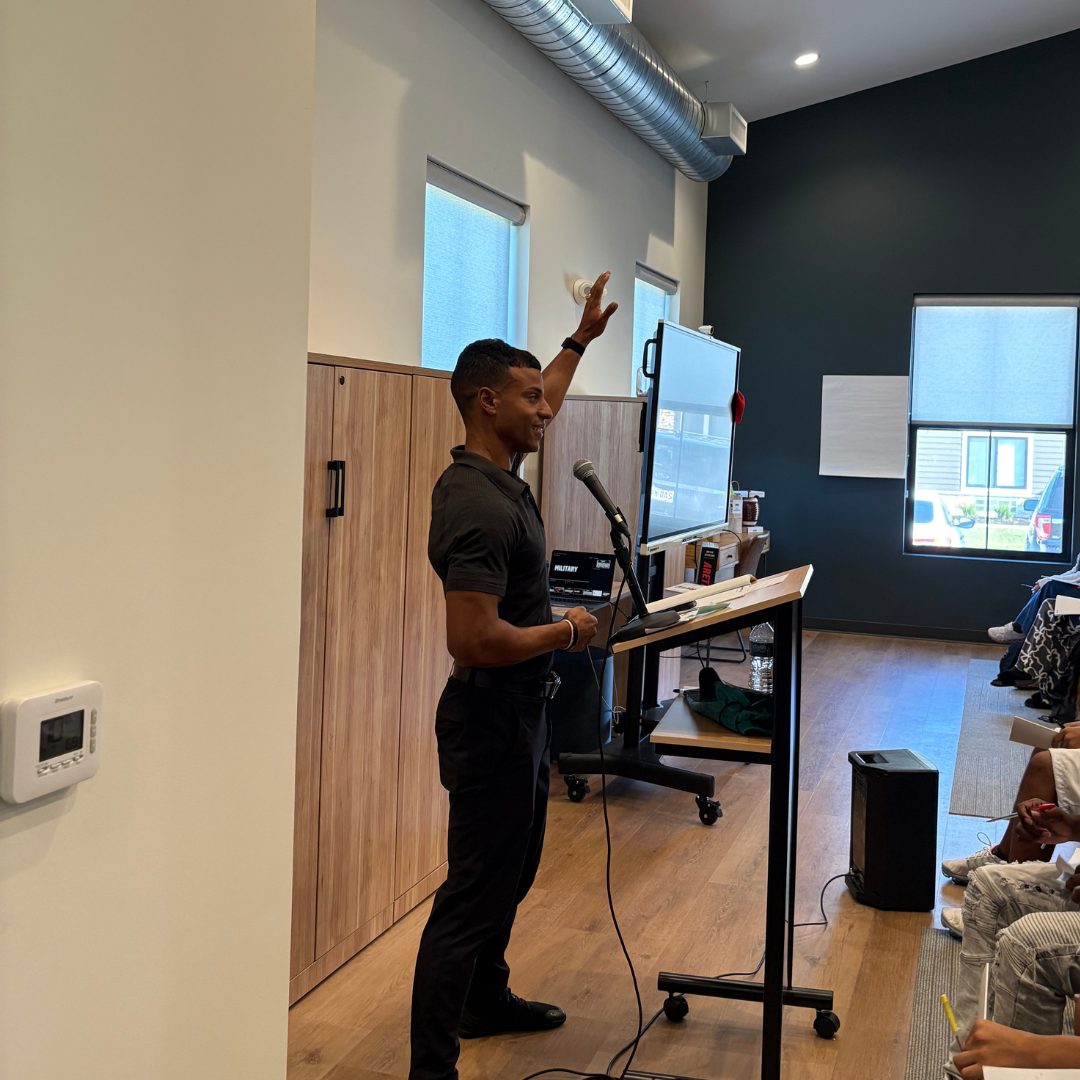 An image of Mr. Jason speaking to the youth.